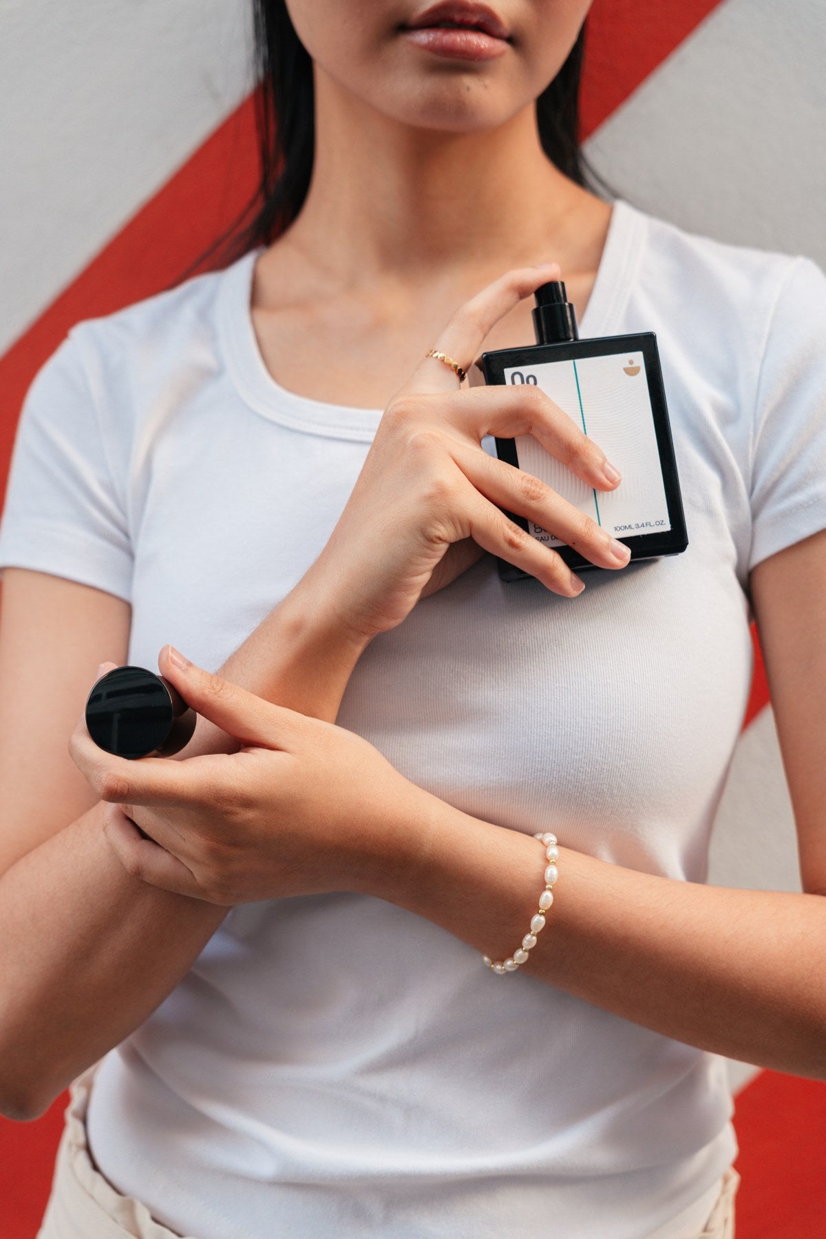 Bangkok campaign portrait holding the Serenity perfume